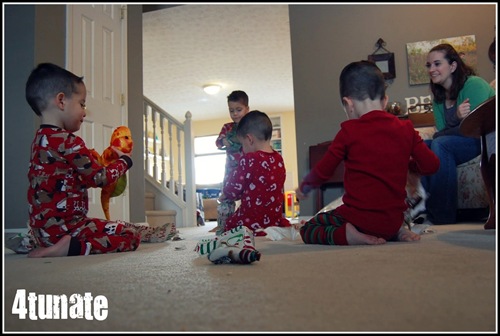 boys opening presents christmas morning