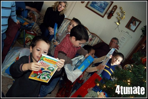 opening presents with lots of boys