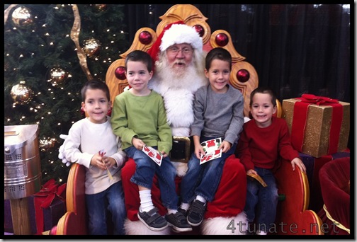 sitting on santa's lap at the christmas gift and hobby show