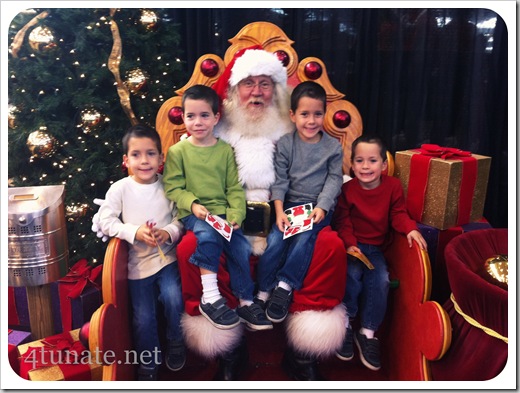 kids sitting on santa's lap for the first time
