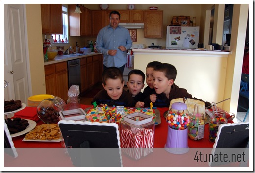 quadruplets birthday party blowing out candles