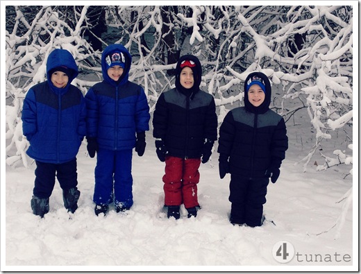 bundling up four boys for the snow