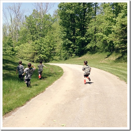 kids trying to catch butterflies